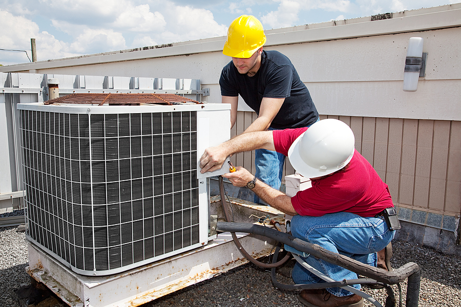 Ft.Lauderdale commerial air conditioning repair technicians working on an industrial AC repair service
